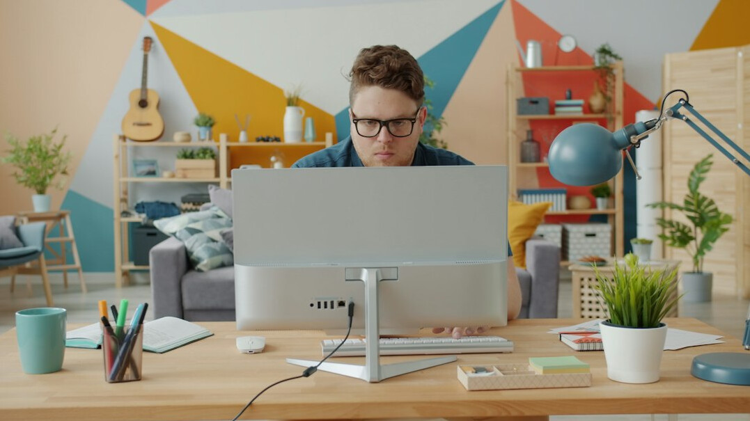 programmer coding at desk